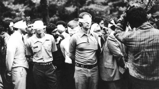Blindfolded American Embassy personnel are paraded for the news cameras (Author unknown)